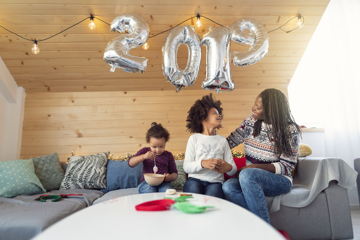 Young African - American woman enjoying new year's morning with her cute daughters - The Law Offices of Jane M. Randall, P.A. - Family Law, Family Mediation, Real Estate Attorney | in York County, Chester County, Lancaster County